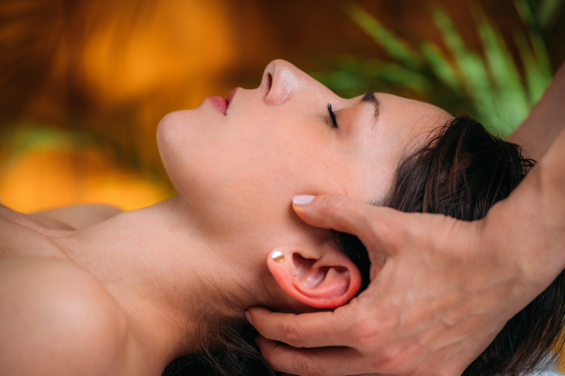 Craniosacral Therapy Massage. CST therapist Massaging of Woman’s Head.