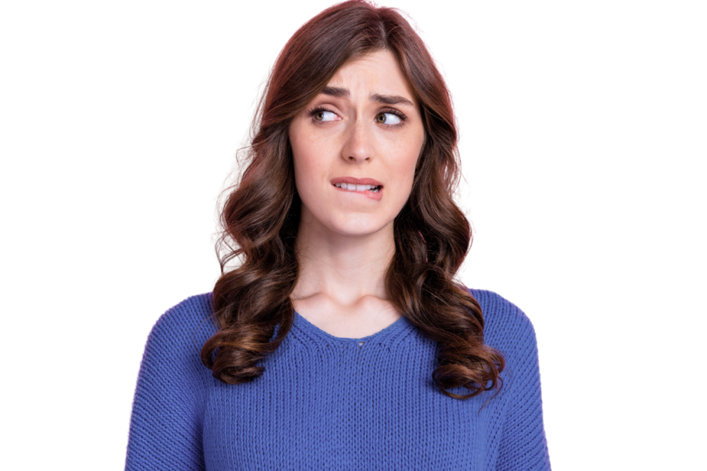 Image of confused woman bitting lip wearing a blue sweater